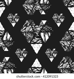 Monochrome graphic seamless pattern with textured hand drawn with ink triangles