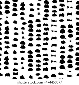 Monochrome hand drawn polka dot vector seamless pattern. Black on white abstract background with round brush strokes. 