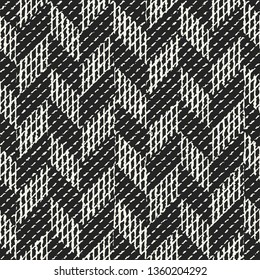 Monochrome Irregularly Dashed Textured Distressed Herringbone Background. Seamless Pattern.