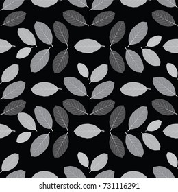 monochrome leaves stacked on a black background.vector pattern seamless illustration