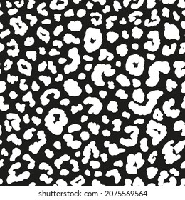 Monochrome leopard seamless repeat pattern. Random placed, vector spots animal skin all over surface print on black background.