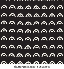 Monochrome minimalistic seamless pattern with arcs. Simple hand drawn texture. Vector background with rounded inky lines 