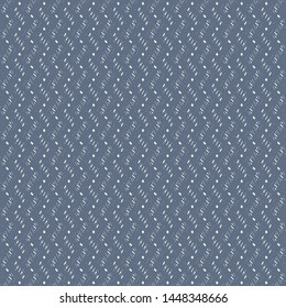 Monochrome pattern composed of zigzag stripes marked with dashes and dots. Blue embroidery texture. Textile. Carpet. Vector illustration.