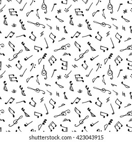 Monochrome seamless music pattern in doodle style on white background. Hand drawn musical theme with clef and note for background, textile, paper packaging, wrapping paper. Vector illustration.