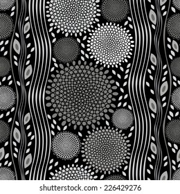 Monochrome seamless pattern of abstract flowers on black background.