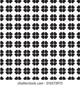Monochrome seamless pattern with clover leaves, the symbol of St. Patrick's Day in Ireland. Texture for scrapbooking, wrapping paper, textiles,