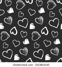 Monochrome seamless pattern with cute grunge white scribbled hearts on black background. Contrast doodle texture for St. Valentines lovely design, textile, wrapping paper, cover, background, wallpaper