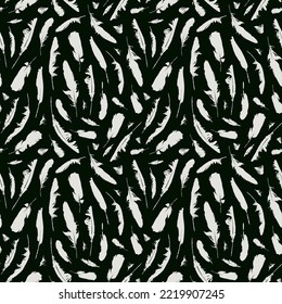 Monochrome seamless pattern with disheveled feathers. Abstract vector background with chaotic scattered bird feathers. White feathers on black backdrop. Suitable for wallpaper, wrapping paper, fabric