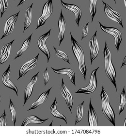Monochrome seamless pattern with halftone leaves drawn by hand on a grey background.Monochrome feathers pattern.