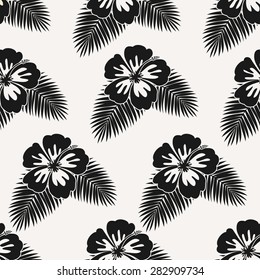 Monochrome seamless repeat pattern with hibiscus flowers and palm leaves.