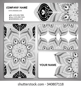 monochrome set of four business card and header templates with hand drawn tribal ornament, mandala, for greeting, invitation card, or cover. Vector illustration
