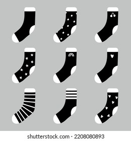 Monochrome socks. Black trendy flat clothing element and with patterns and ornaments. Vector set black stocking illustrations