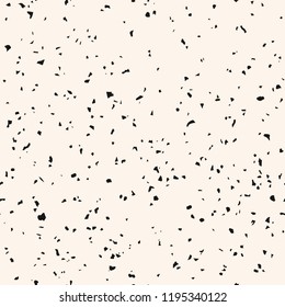 Monochrome terrazzo flooring texture. Vector seamless pattern with chaotic scattered confetti. Black and white grunge texture. Hipster fashion design. Repeatable background for decor, print, wallpaper
