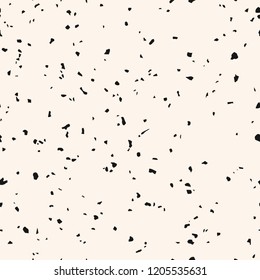 Monochrome terrazzo texture. Vector seamless pattern with chaotic scattered shapes, chips, confetti. Simple black and white grunge background texture. Trendy repeat design for decor, print, wallpapers