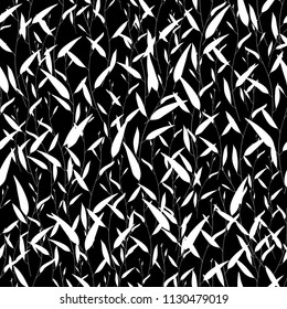 Monochrome tropical seamless pattern. Trendy black and white vector texture. Good for fashion print, fabric, wallpaper or your design. Hand drawn branches with leaves. Dark background