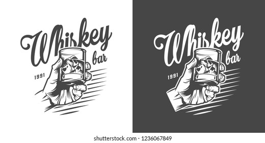 Monochrome whisky bar logotype with male hand holding glass of strong alcohol and ice cubes in vintage style isolated vector illustration