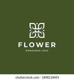 Monogram Flower or leaf logo design vector illustration on green background