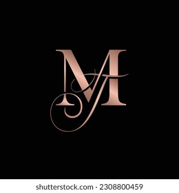 Monogram initial logo of MT or TM in cursive and bold.