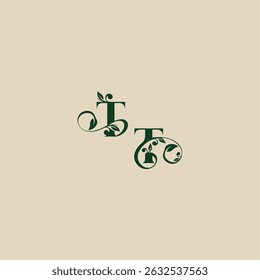 con el monograma y el concepto de la hoja de la letra orgánica hermosa elegante del logotipo de la boda del TT
