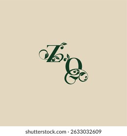 con el monograma y el concepto de la hoja de la letra orgánica hermosa elegante del logotipo de la boda de QZ
