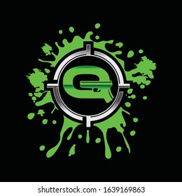 monogram letter Q for gun tactical logo vector in green splash black background 