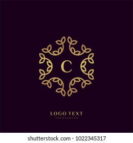 Monogram logo with golden letter "C"