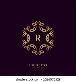 Monogram logo with golden letter "R"