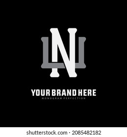 Monogram logo, Initial letters U, N, UN or NU, white and grey color on black background