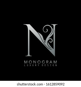 Monogram Luxury N Logo Letter. Simple luxuries vector design concept abstract nature floral leaves  with letter logo icon silver color.