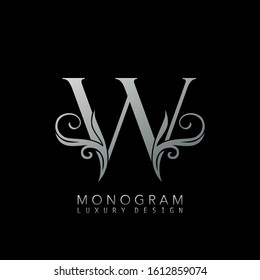 Monogram Luxury W Logo Letter. Simple luxuries vector design concept abstract nature floral leaves  with letter logo icon silver color.