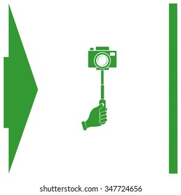 Monopod camera with hand vector icon.