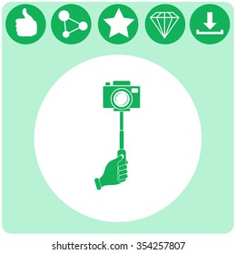 Monopod camera with hand vector icon.