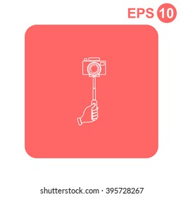 Monopod camera with hand vector icon.