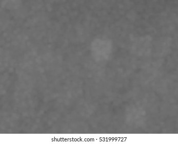 Monotone spotted surface. Abstract grey background, vector EPS10. Not trace image, include mesh gradient only