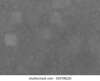 Monotone spotted surface. Abstract grey background, vector EPS10. Not trace image, include mesh gradient only