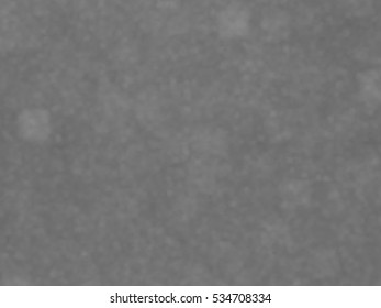 Monotone spotted surface. Abstract grey background, vector EPS10. Not trace image, include mesh gradient only