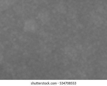 Monotone spotted surface. Abstract grey background, vector EPS10. Not trace image, include mesh gradient only