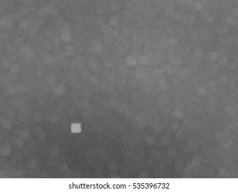 Monotone spotted surface. Abstract grey background, vector EPS10. Not trace image, include mesh gradient only