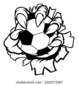 A monster or animal claw holding a soccer football ball and breaking through the background