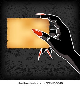 Monster hands hold old card paper for Halloween background