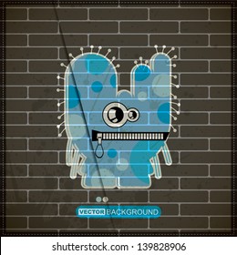 Monster on old brick wall