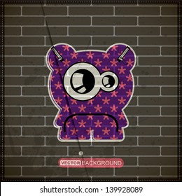 Monster on old brick wall