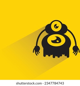 monstruo con sombra sobre fondo amarillo