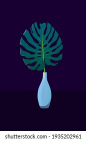 Monstera leaf in a blue vase on a dark background