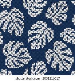 Monstera white leaves on navy blue background. Jacquard knitted seamless pattern. Vector illustration.