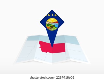 Montana is depicted on a folded paper map and pinned location marker with flag of Montana. Folded vector map.