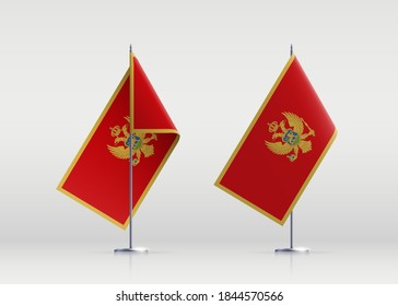 Símbolo del estado de la bandera de Montenegro aislado en una bandera nacional de fondo. Tarjeta de saludo Día de la Independencia Nacional de la República de Montenegro. Cartel de ilustración con bandera de estado realista.