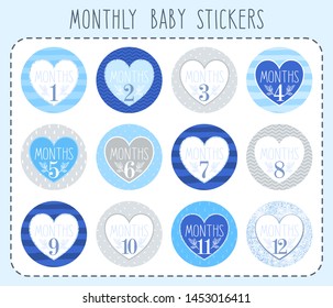 Monthly baby stickers for newborn boys. Monthly growth stickers for clothes, design with a heart, gray-blue colors. Set for a photo shoot or baby shower party.