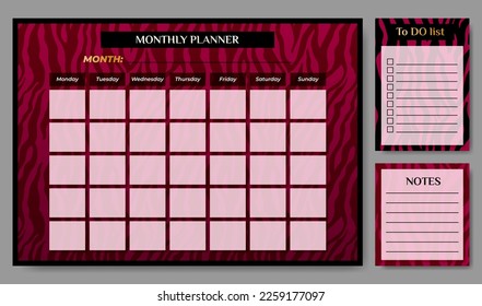 Monthly planner with To Do list on zebra backdrop.