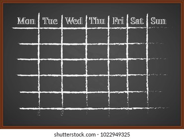 Monthly schedule drawn with chalk on a blackboard